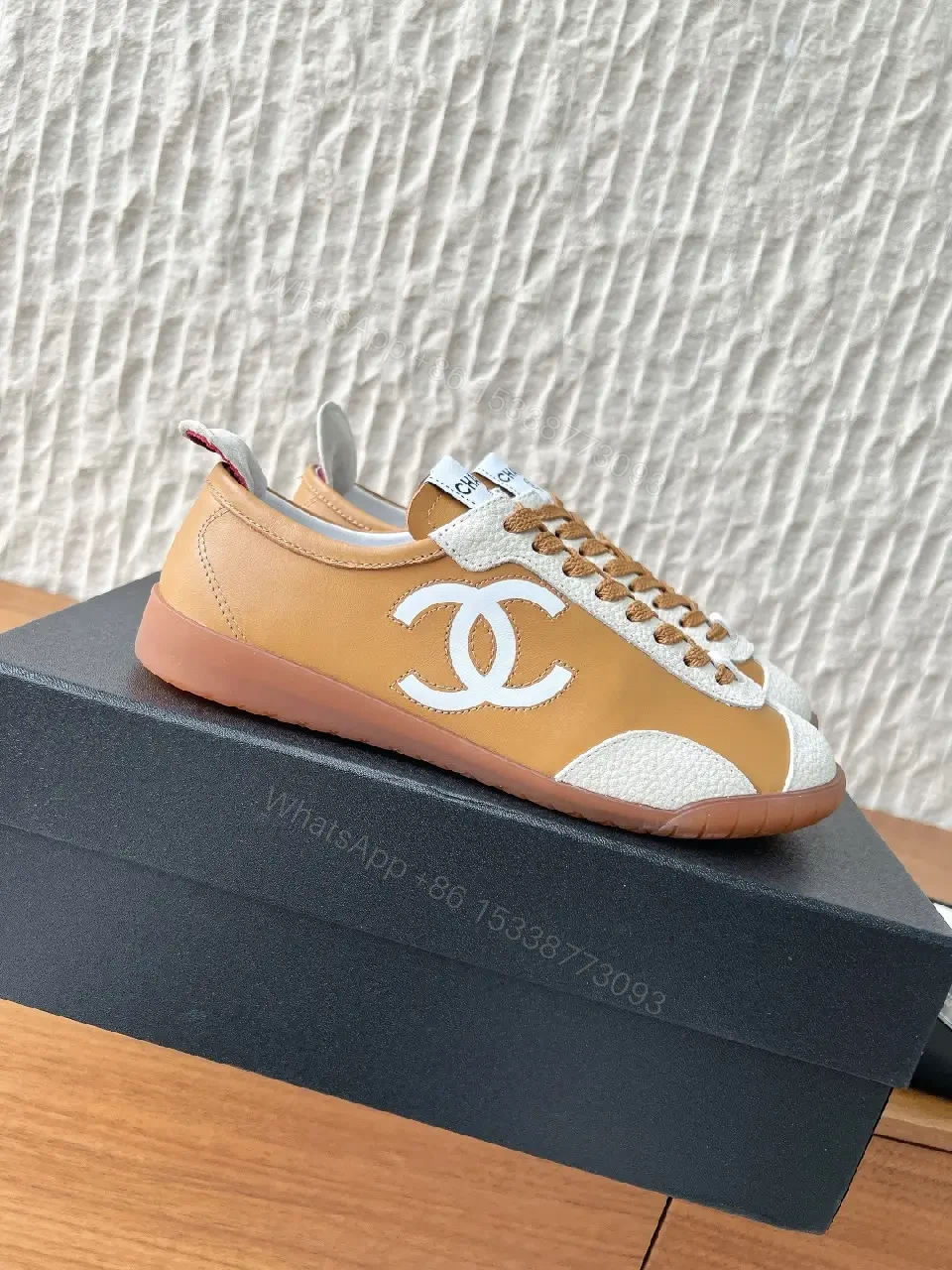 View 3 of Brown Leather High-Top Sneaker with Contrast Texture and Logo