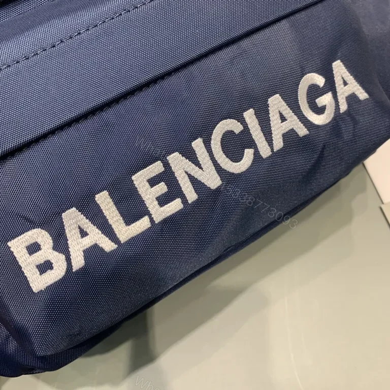 View 4 of Bold Navy Balenciaga Belt Bag with Red Strap - Hands-Free Luxury