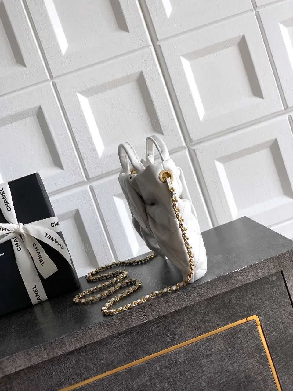 View 8 of Pearl White Quilted Satin Mini Bag with Bow Detail and Gold Logo