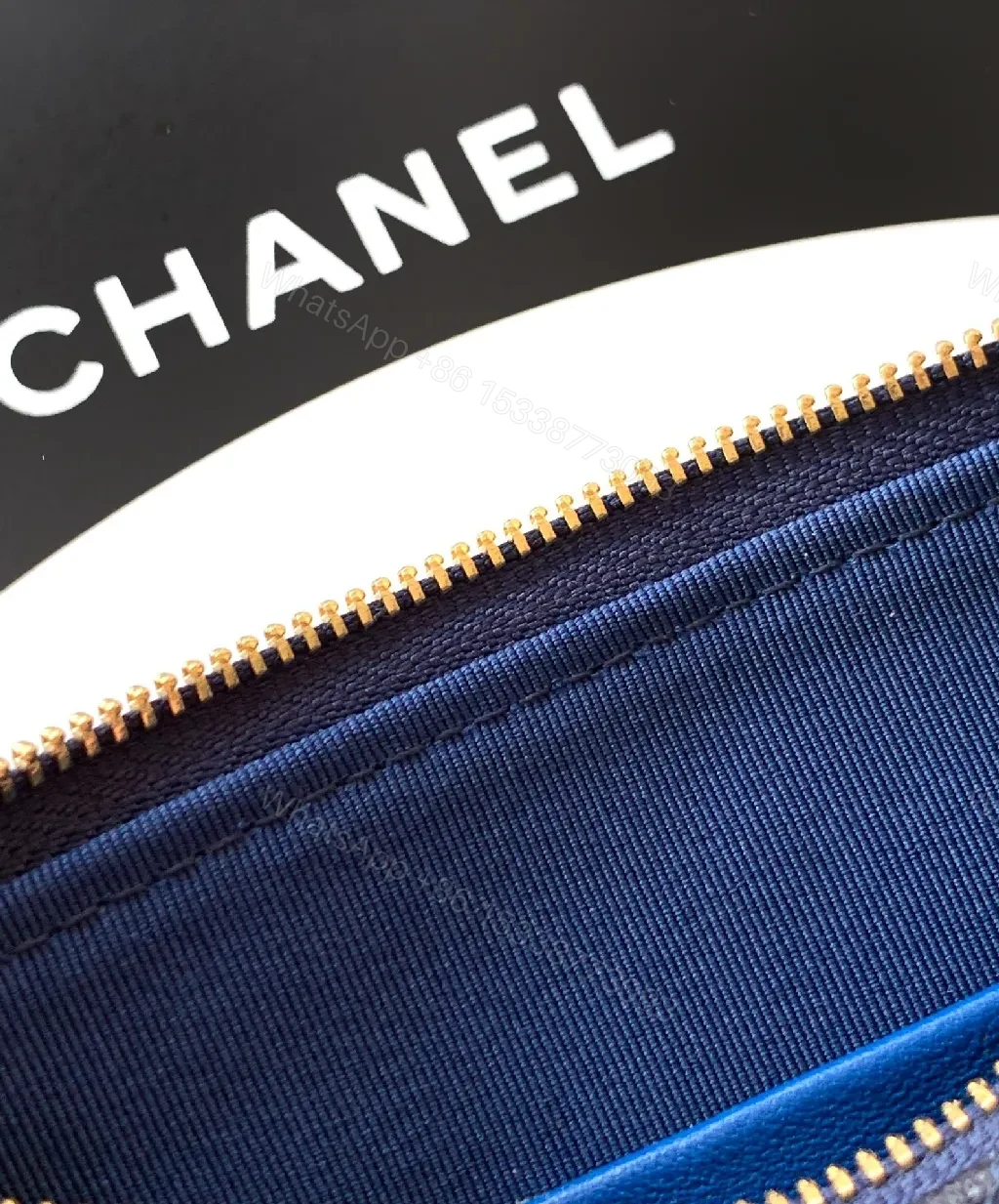 View 7 of Navy Quilted Crossbody: Gold-Emblem, Compact Luxury Bag