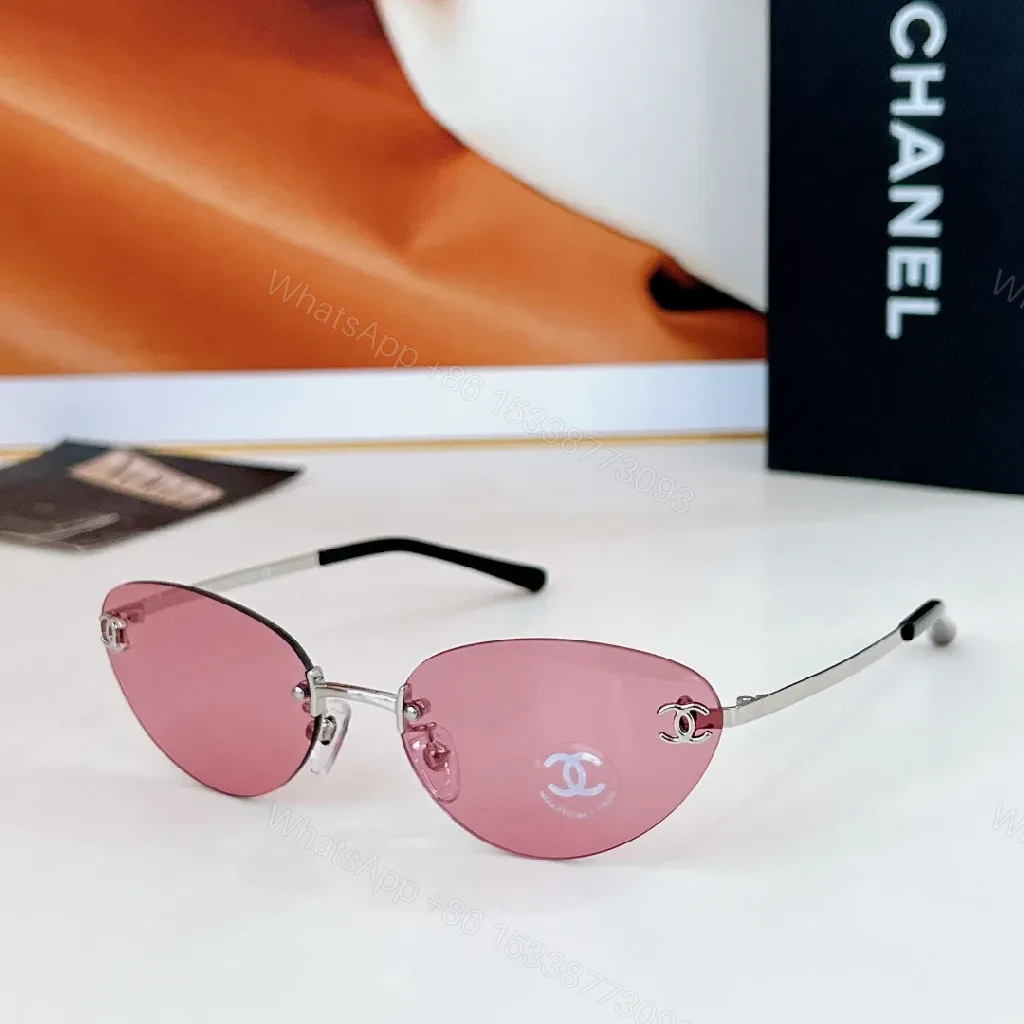 View 7 of Rimless Blue Lens Sunglasses with Gold-Tone Frames