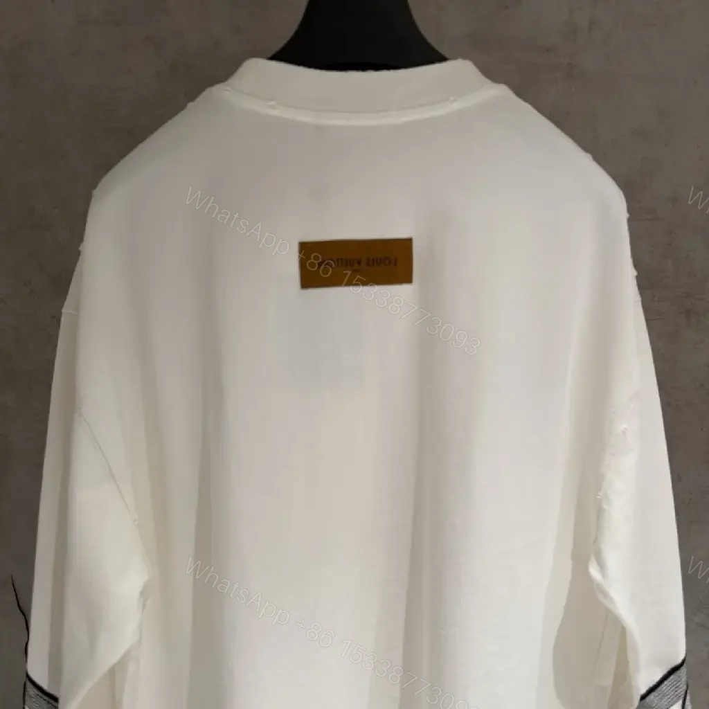 View 2 of White Cotton-Blend Pullover with LV Logo & Architectural Sleeves