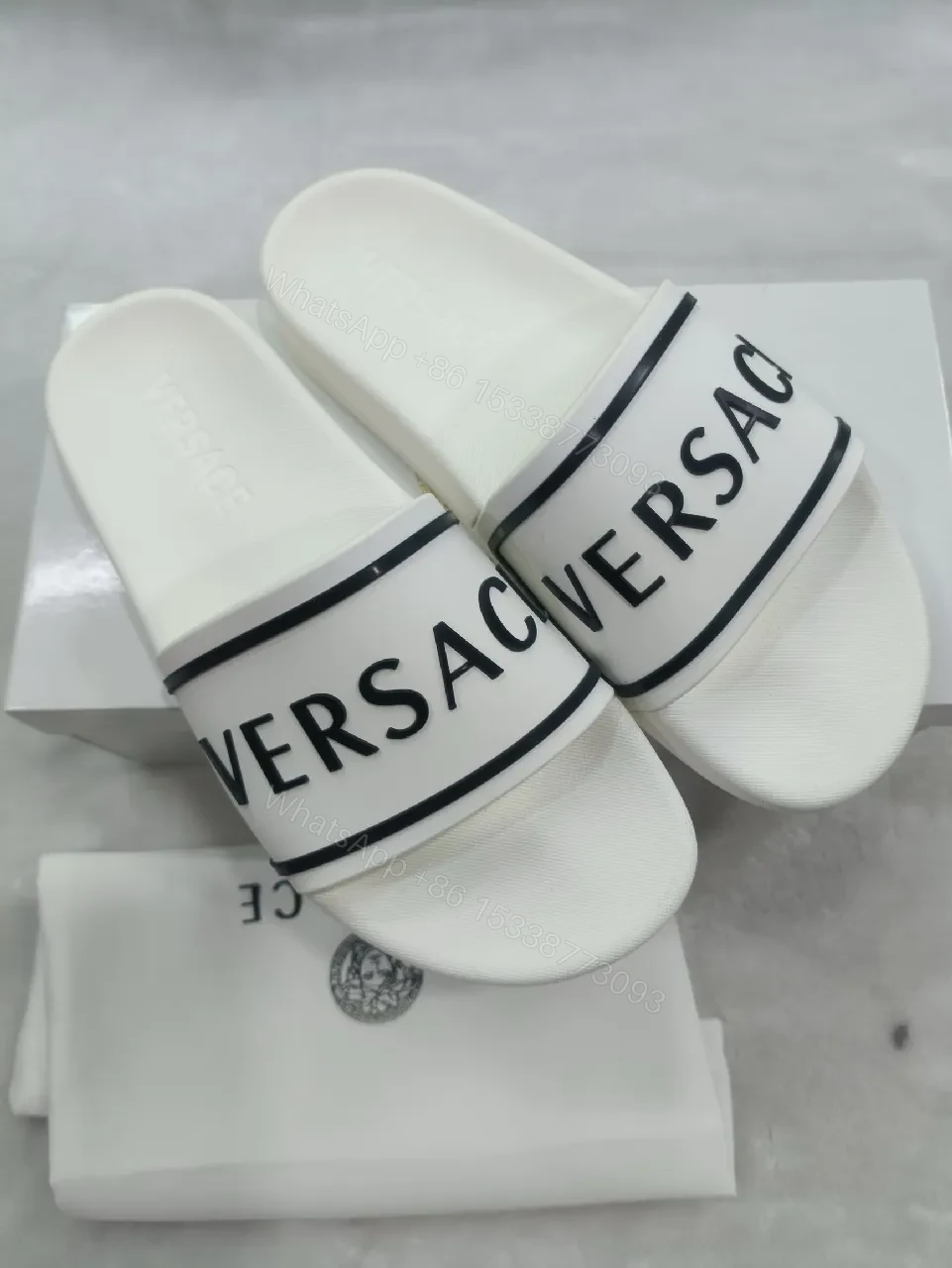 View 6 of White Leather Slide with Bold Brand Stripe, Unisex Comfort