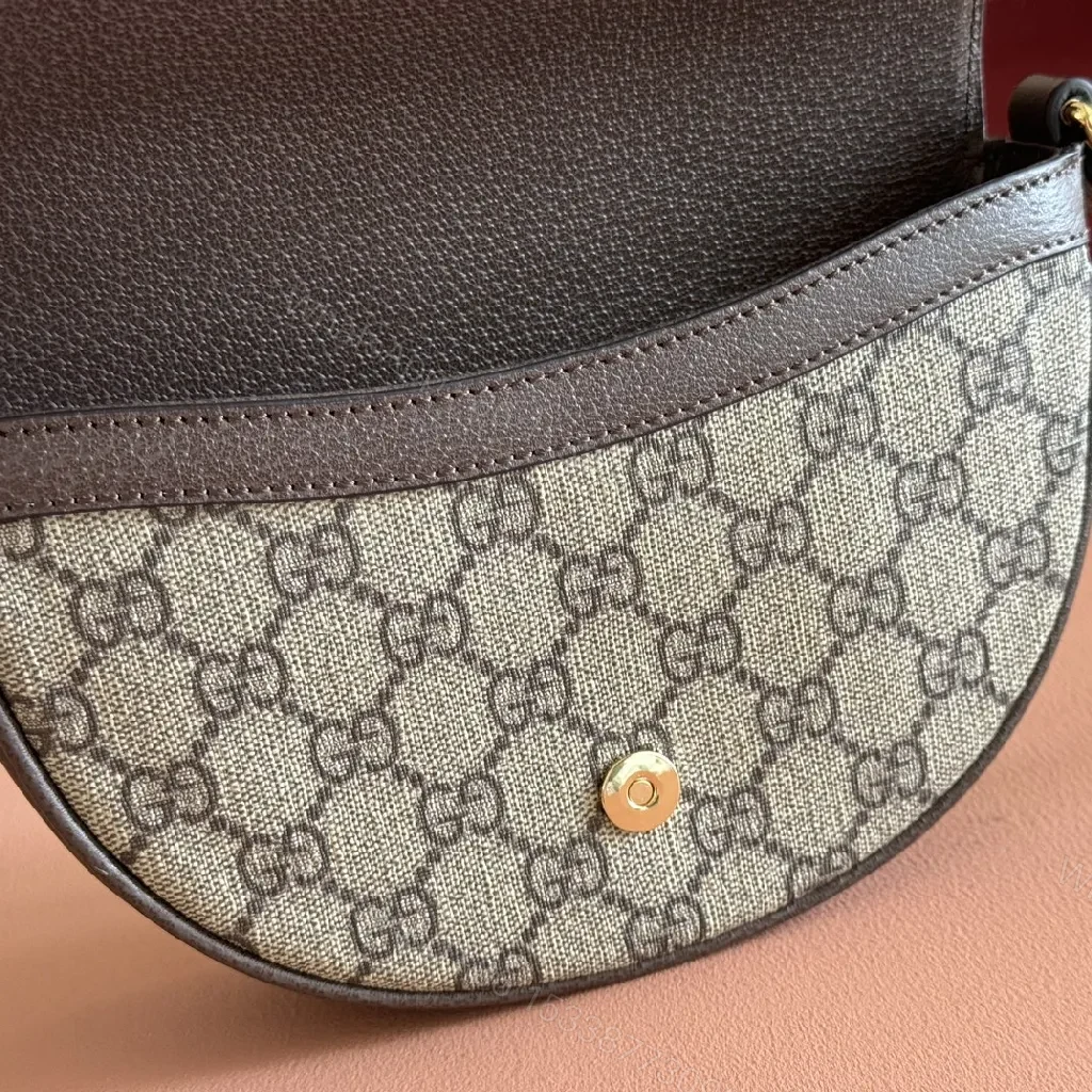 View 4 of Green Canvas Saddle Bag: Luxe Crossbody with Web Stripe and Gold Hardware