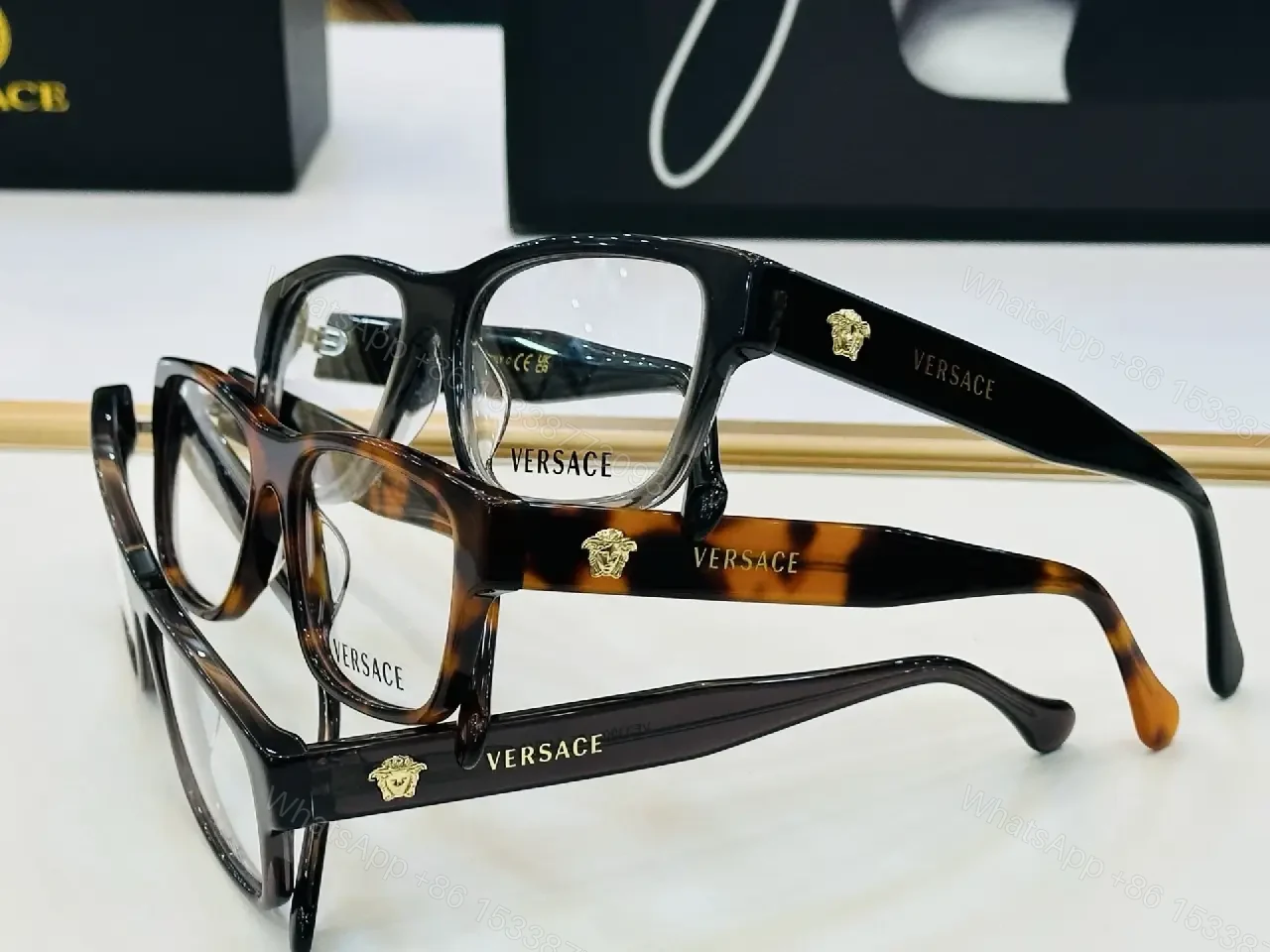 View 5 of Bold Black Acetate Square Glasses with Gold Logo Emblems