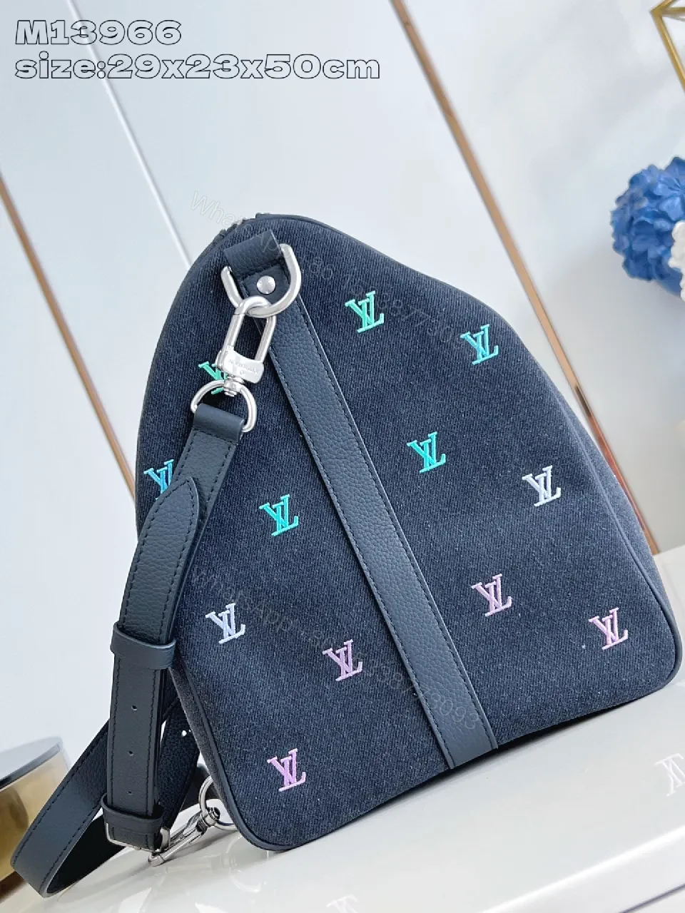 View 2 of Bold Denim Travel Bag with Multicolor Monogram Details