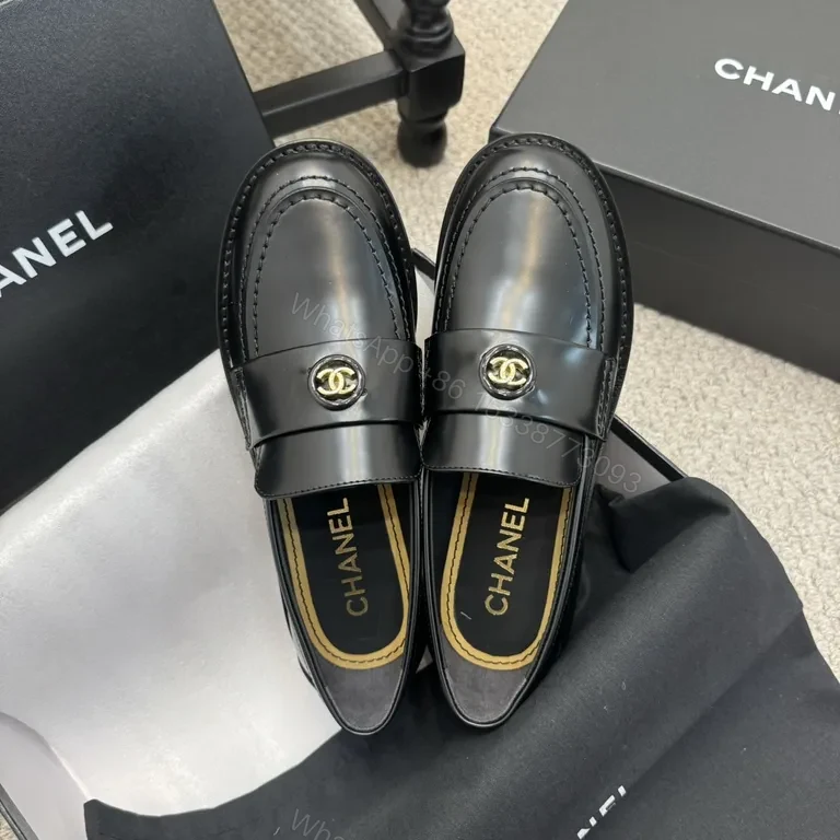 View 9 of Refined Black Leather Loafers with Gold Crest â€“ Luxe Comfort