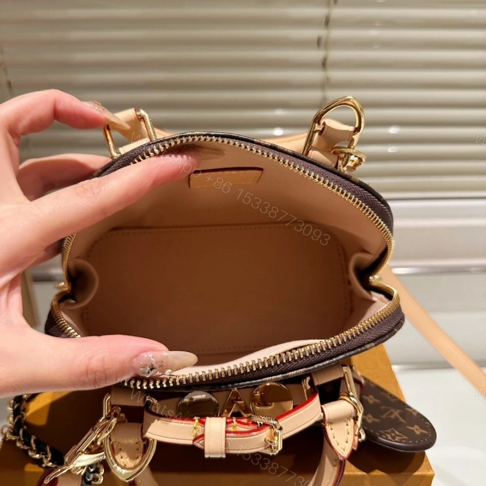 View 7 of Louis Vuitton Alma Mini LV And I Monogram Brown 25Cm K00016