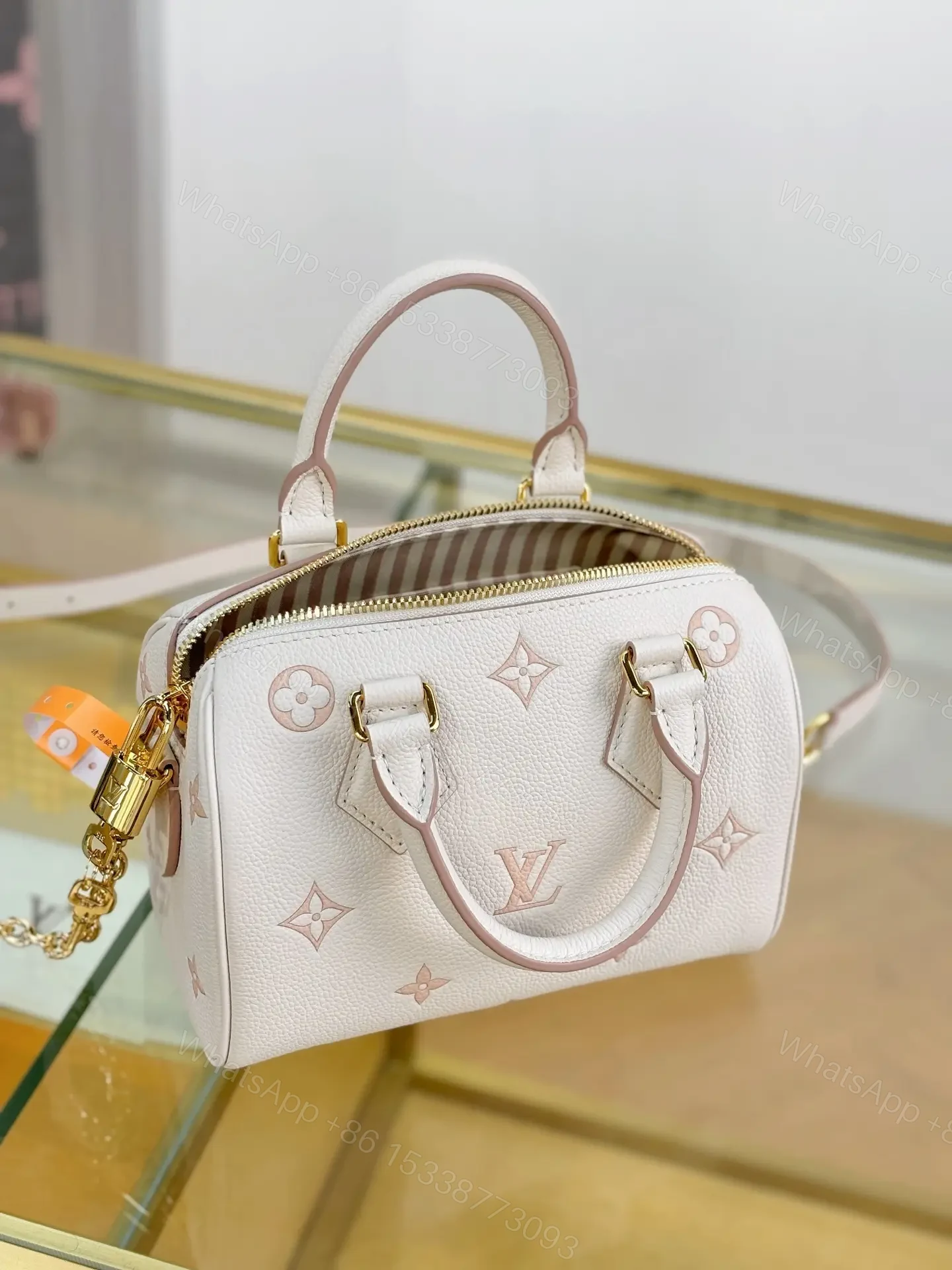 View 3 of Louis Vuitton Monogram Empreinte Bicolor Speedy Bandoulière 20