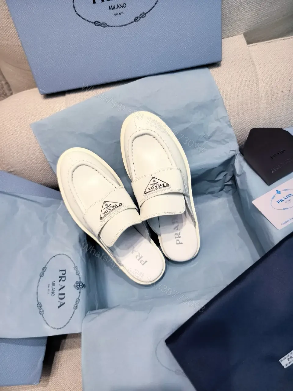View 3 of White Leather Prada Slip-ons: Classic Padded Comfort Shoes