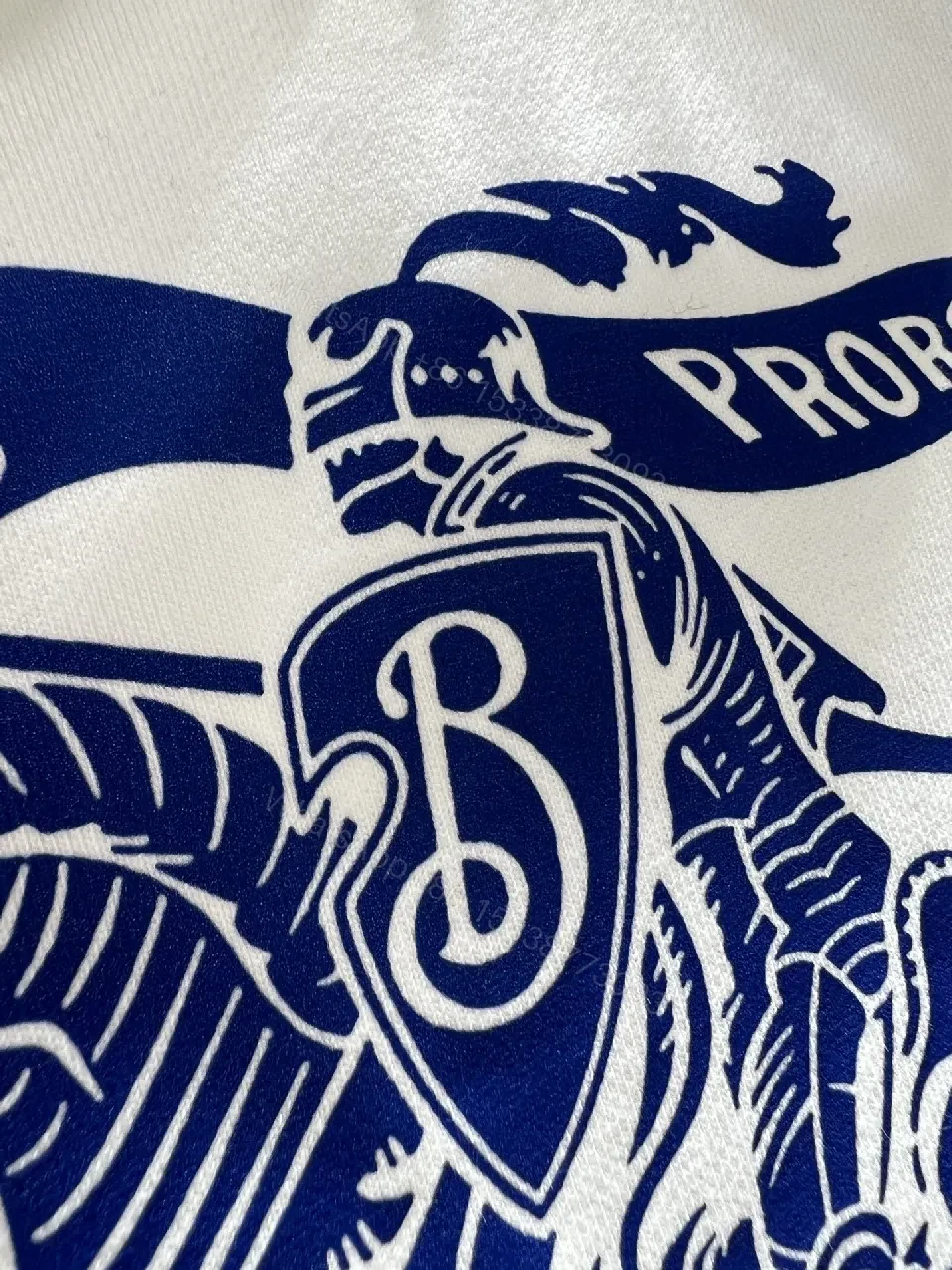View 6 of White Hoodie with Bold Crest Graphic—Premium Comfort Streetwear