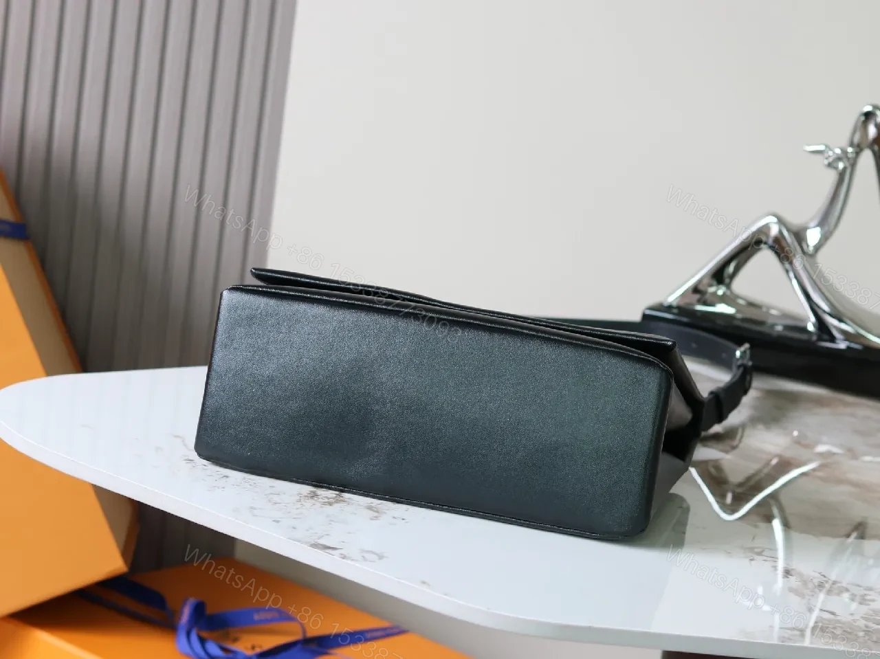 View 9 of Structured Minimalist Clutch: Luxe Faux Leather, Embossed Logo, Magnetic Closure