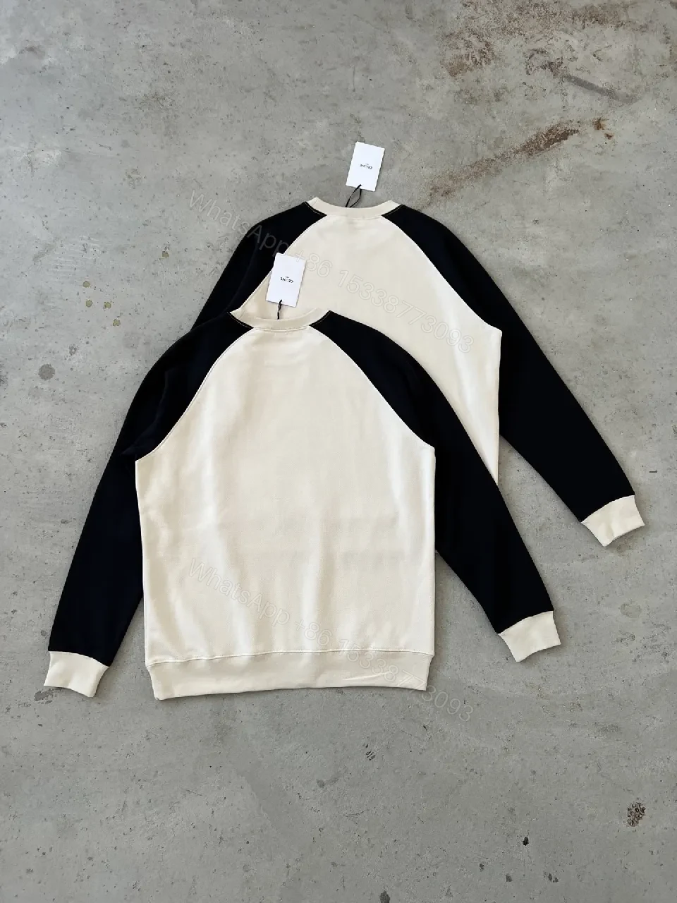 View 5 of Bold Contrast Crest Sweatshirt - Cream Body, Black Sleeves, Luxe Comfort