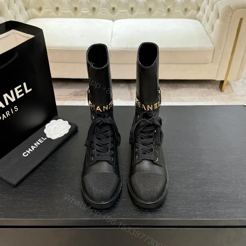 Chic Black Combat Boots with Gold Detailing - High-Top Style — view 1