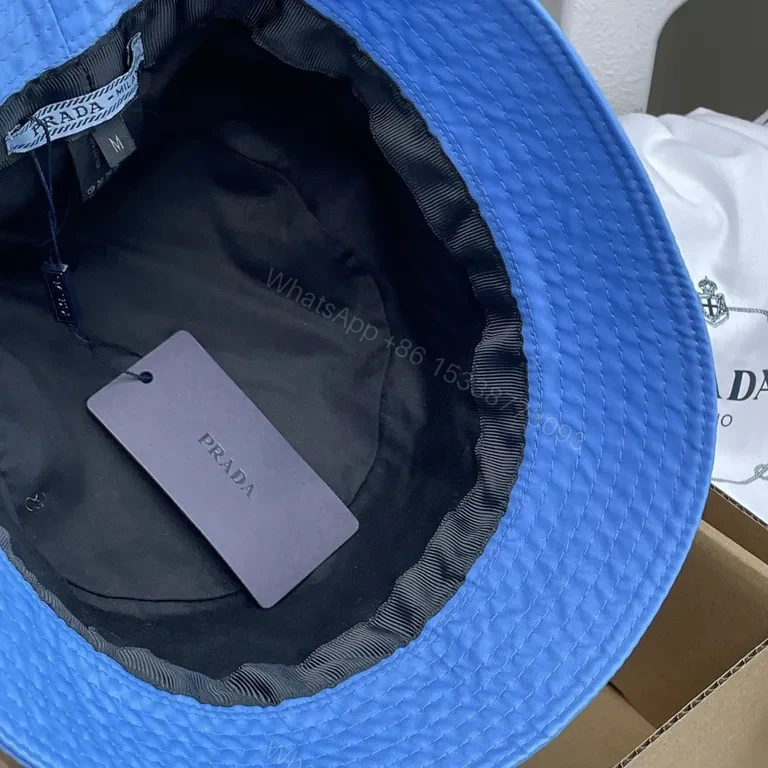 View 2 of Blue Prada Bucket Hat: Luxe Nylon, Sun-Protection, Packable