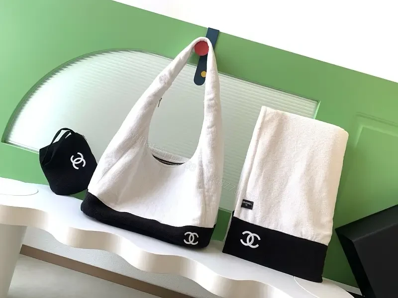 White Fabric Handbag with Black Trim Slouchy Style Chanel Logo Tote — view 1