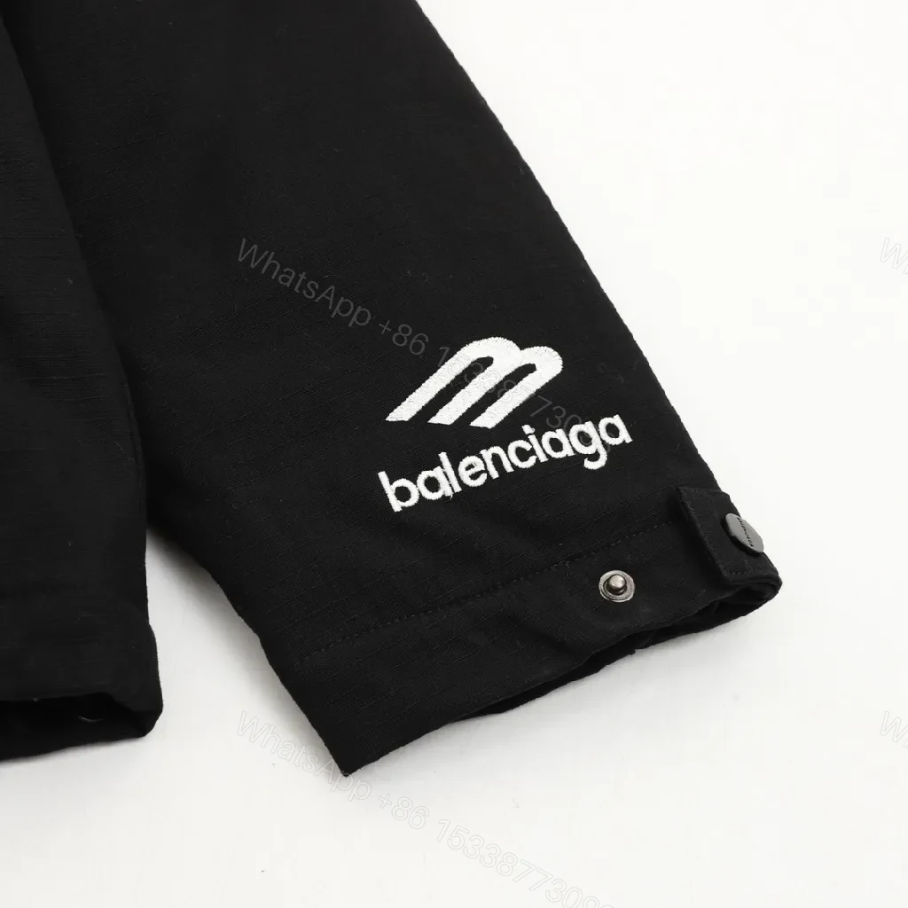 View 10 of Black Puffer Hoodie — Minimalist Luxury, Water-Repellent, Zip Pockets