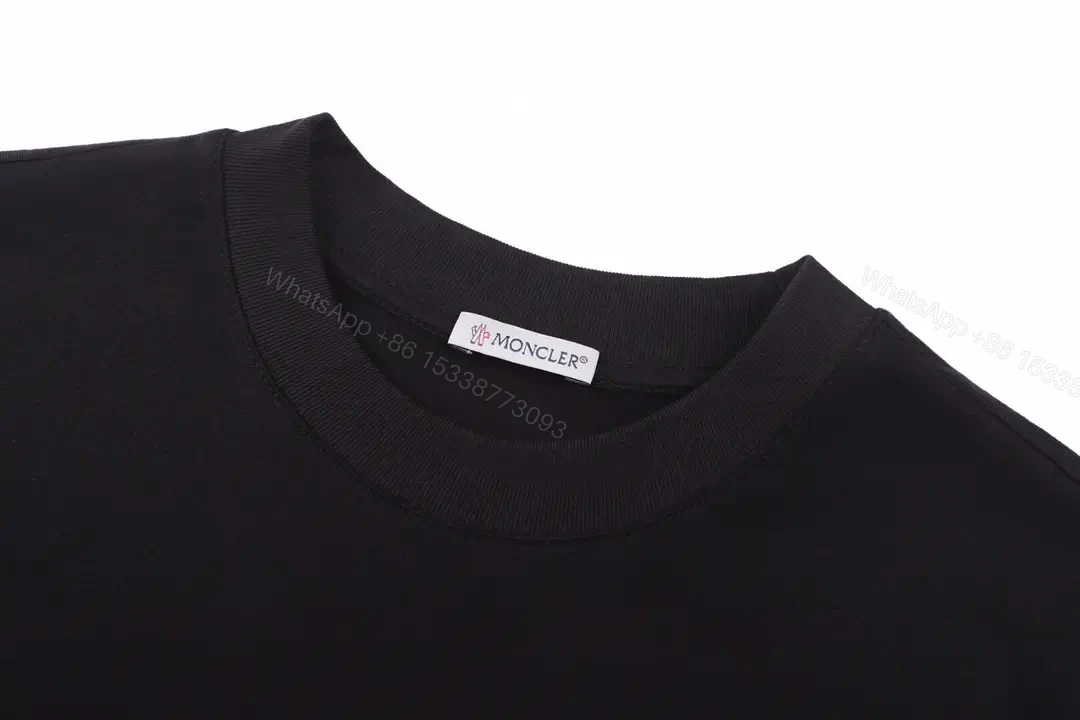 View 6 of Matte Black Cotton Tee with Subtle Embossed Logo, Modern Comfort