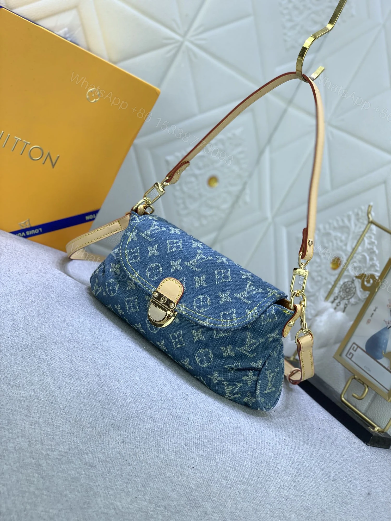 View 2 of Louis Vuitton Pleaty bag in blue denim