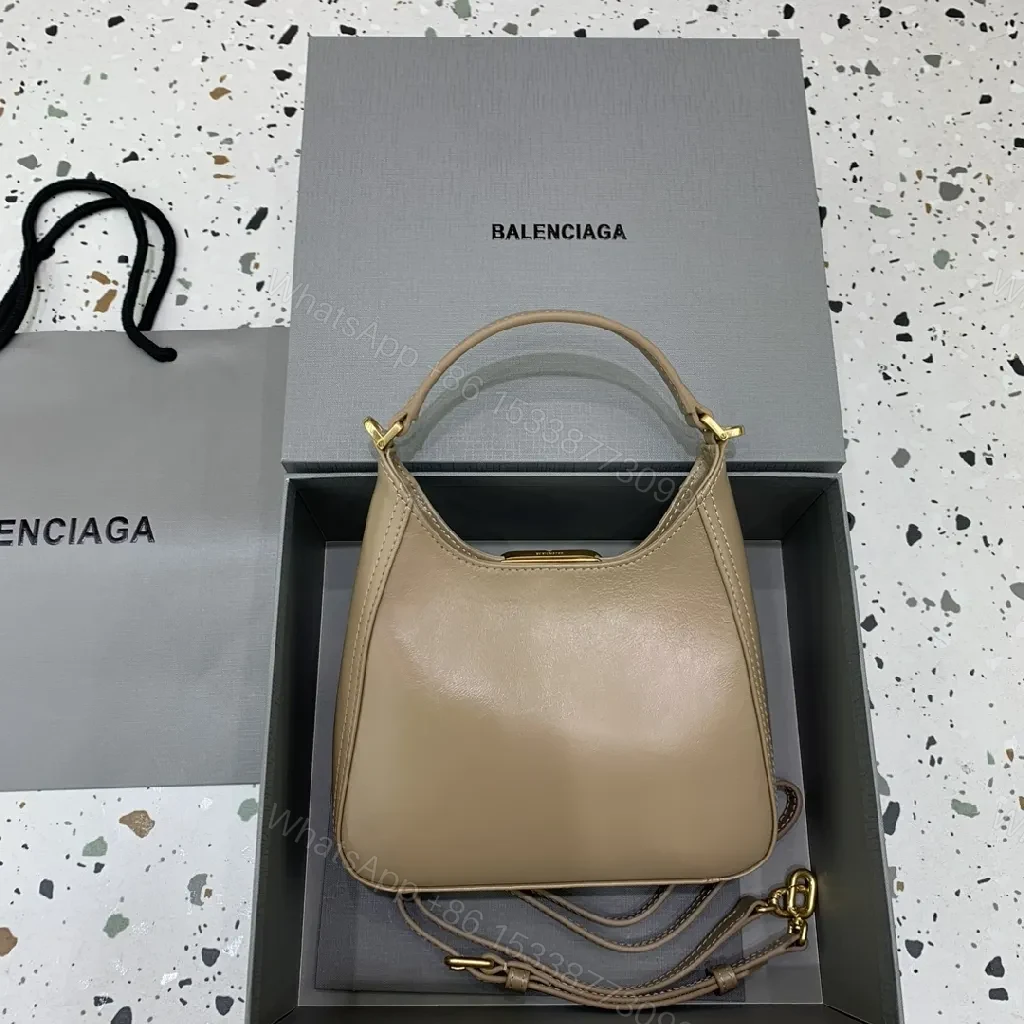 View 7 of Compact Taupe Leather Handbag with Gold Hardware, Crossbody Ready