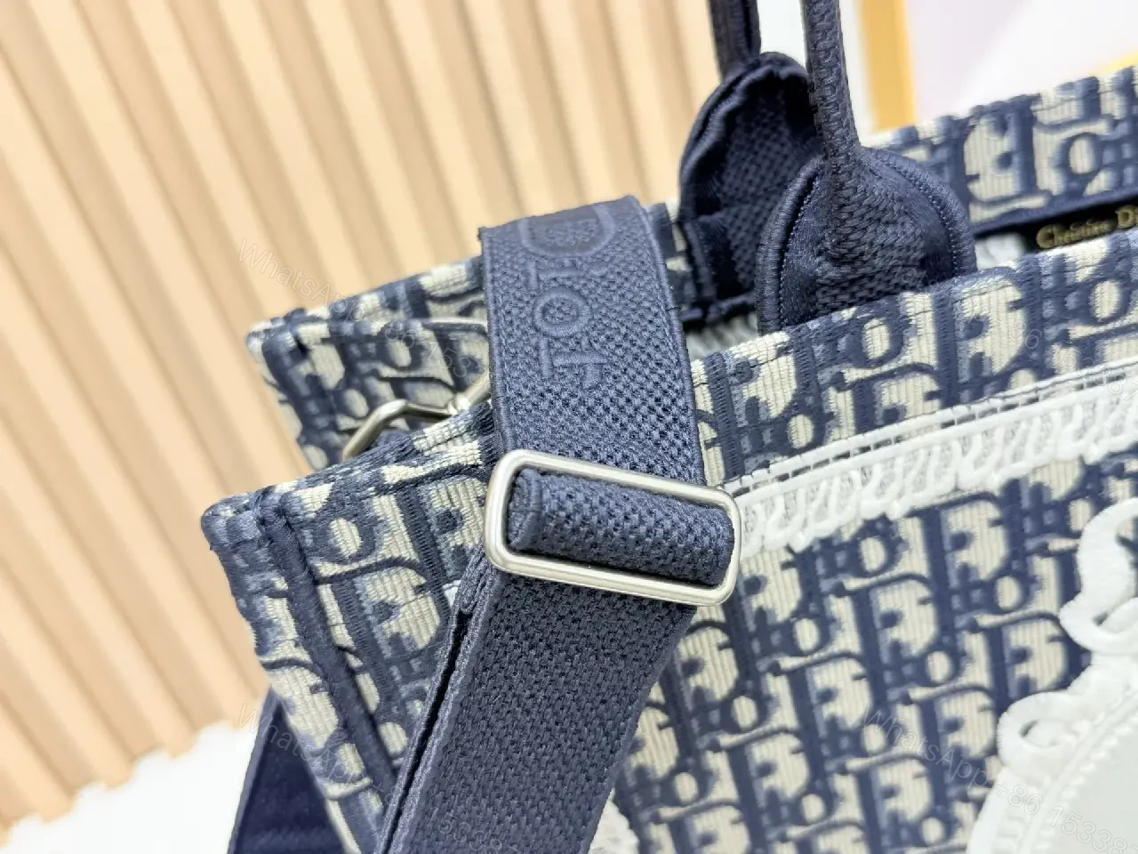 View 8 of Textured tote bag: structured luxury, bold lettering, durable