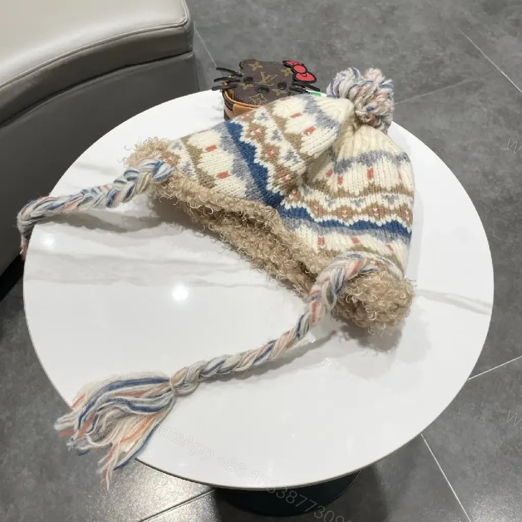 View 2 of Cozy Alpine Knit Beanie with Faux Shearling Brim and Patch