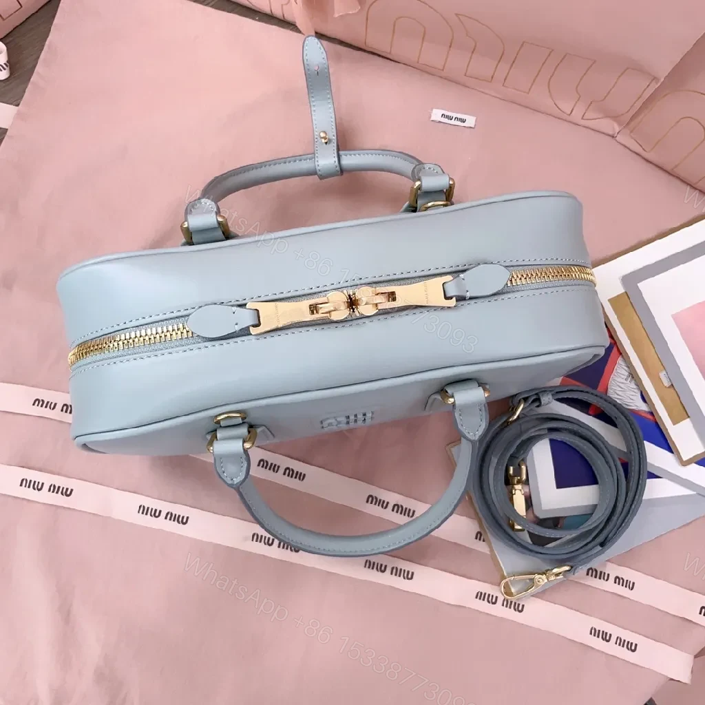View 5 of Structured Dome Bag: Compact Luxury, Gold Accents, Versatile Style