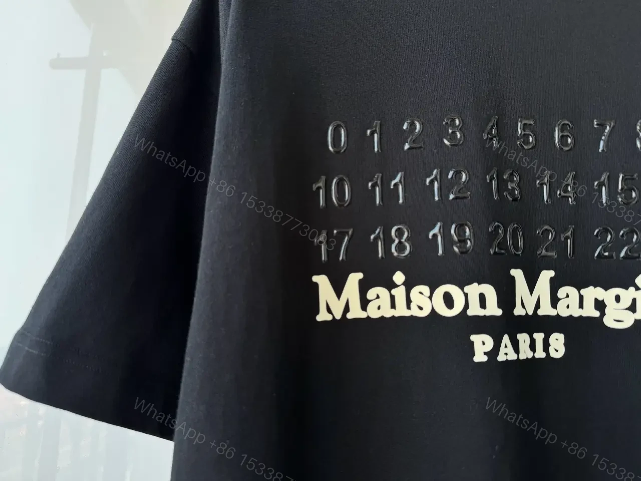 View 8 of Oversized Black Tee with Embossed Numeric Grid - Modern Graphic Comfort