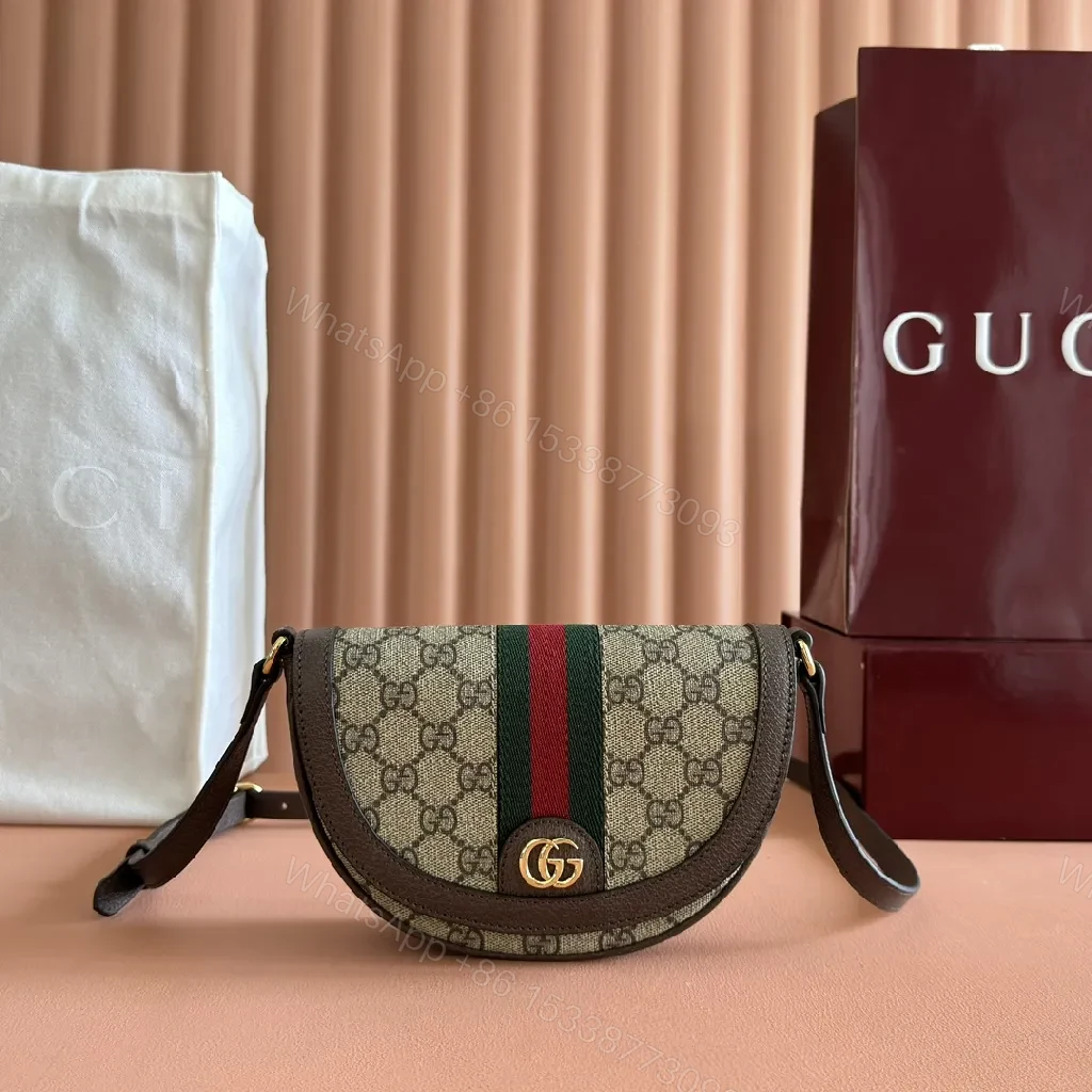 Green Canvas Saddle Bag: Luxe Crossbody with Web Stripe and Gold Hardware — view 1