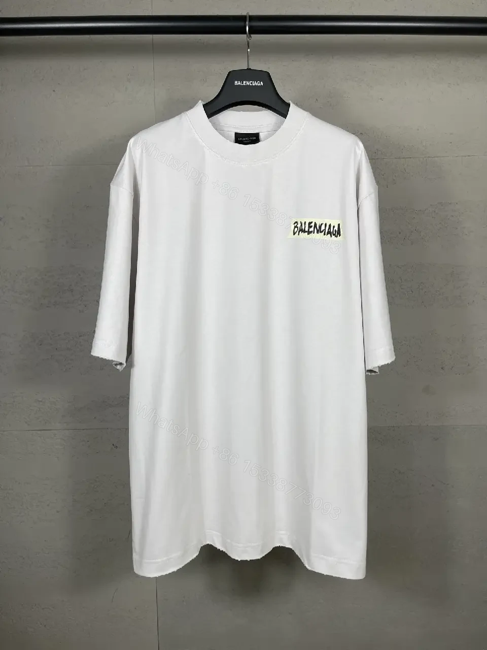 View 4 of Oversized White Tee with Signature Patch - Minimalist Luxe