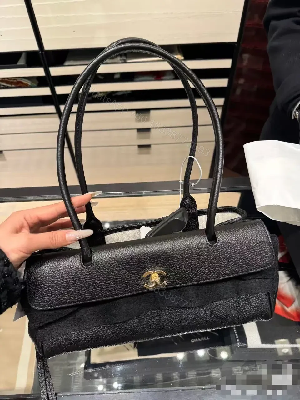 View 3 of Quilted Black Leather Handbag with Gold Hardware Luxury