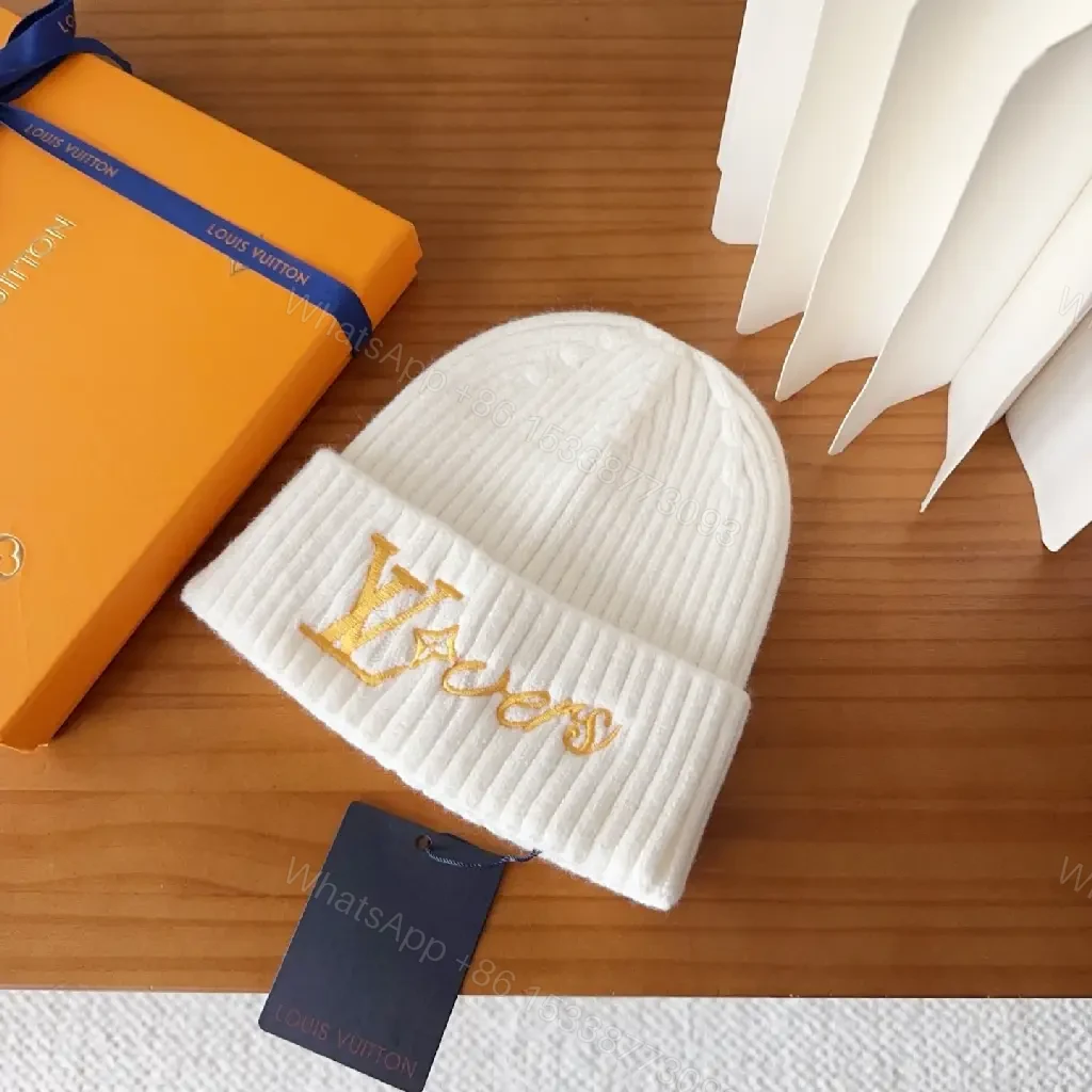View 2 of Cozy Knit Beanie with Subtle Gold Monogram Embroidery