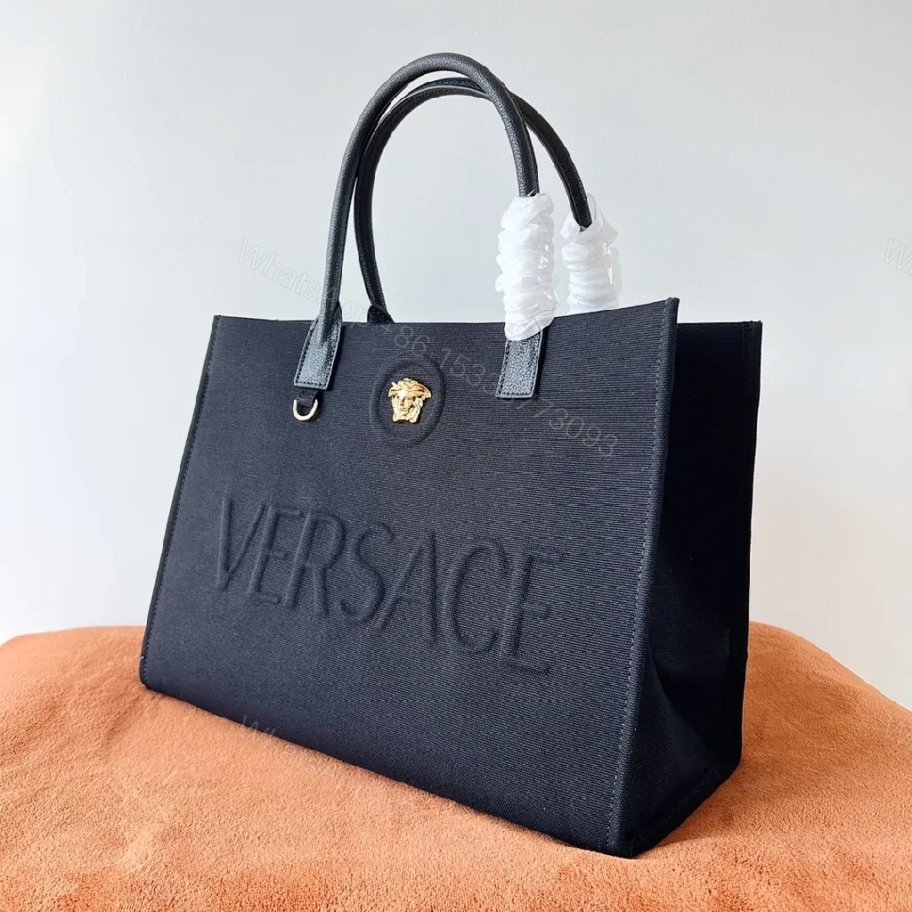 View 2 of Structured Sophistication Tote: Black, Matte Shell, Modern Luxury, Gold Hardware