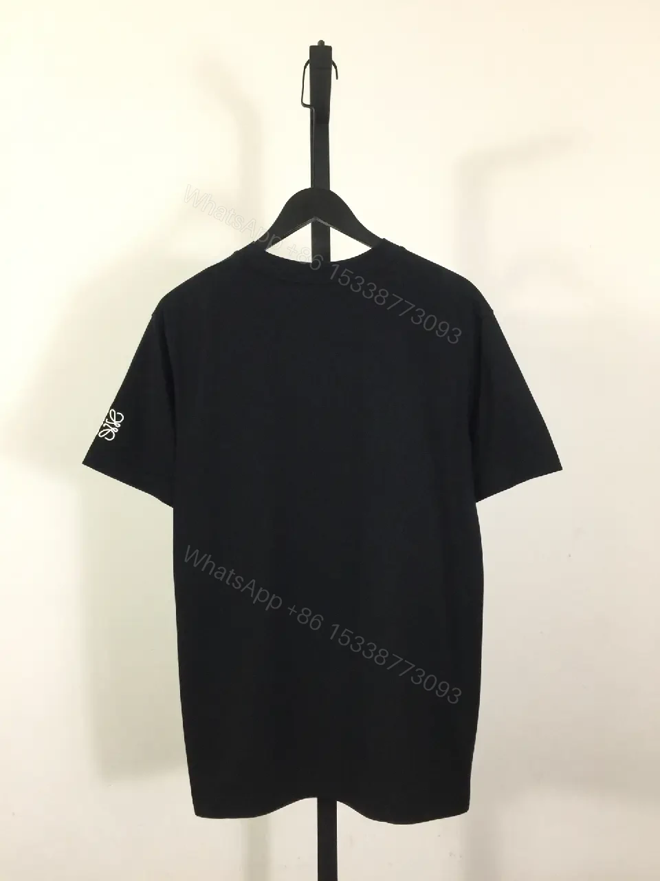 View 8 of Minimalist Black Tee: Subtle Branding, Everyday Luxury Tee