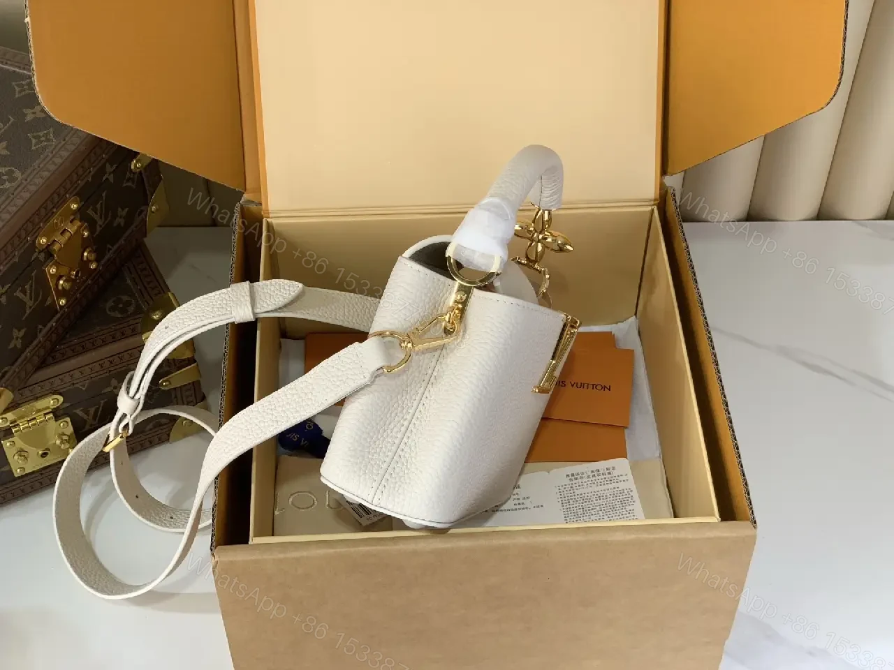 View 2 of Chic Textured Leather Mini Bag with Gold Emblem