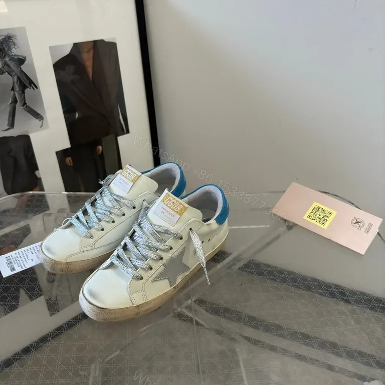 View 3 of Premium Off-White + Leather Sneaker with Blue Heel & Star Details