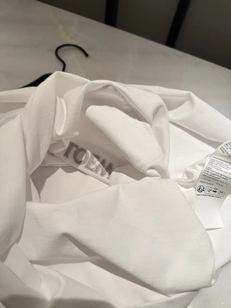View 10 of Minimalist White Tee with Structured Pocket & Logo Emblem