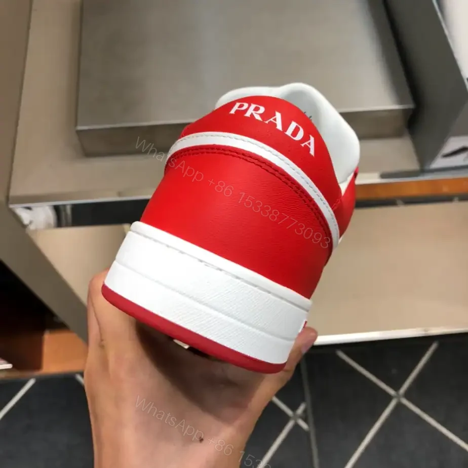 View 9 of PRADA DOWNTOWN LEATHER SNEAKERS IN WHITE AND LACQUER RED- PRD012