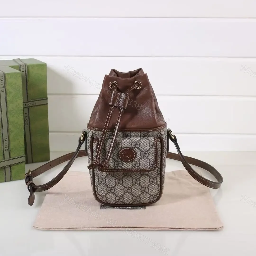 GUCCI GG Supreme Mini Leather-Trimmed Bucket Bag — view 1