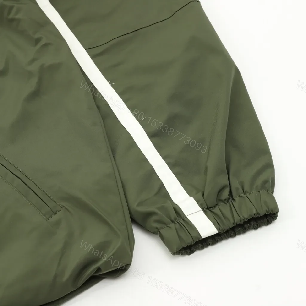 View 9 of Olive Pave Coach Jacket: Subtle Stride, Bold Presence