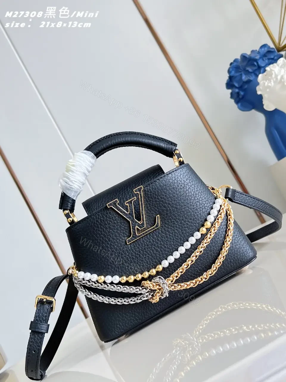 View 4 of Luxurious Mini Bag: Pebbled Leather, Layered Chains, Crossbody Embellishments