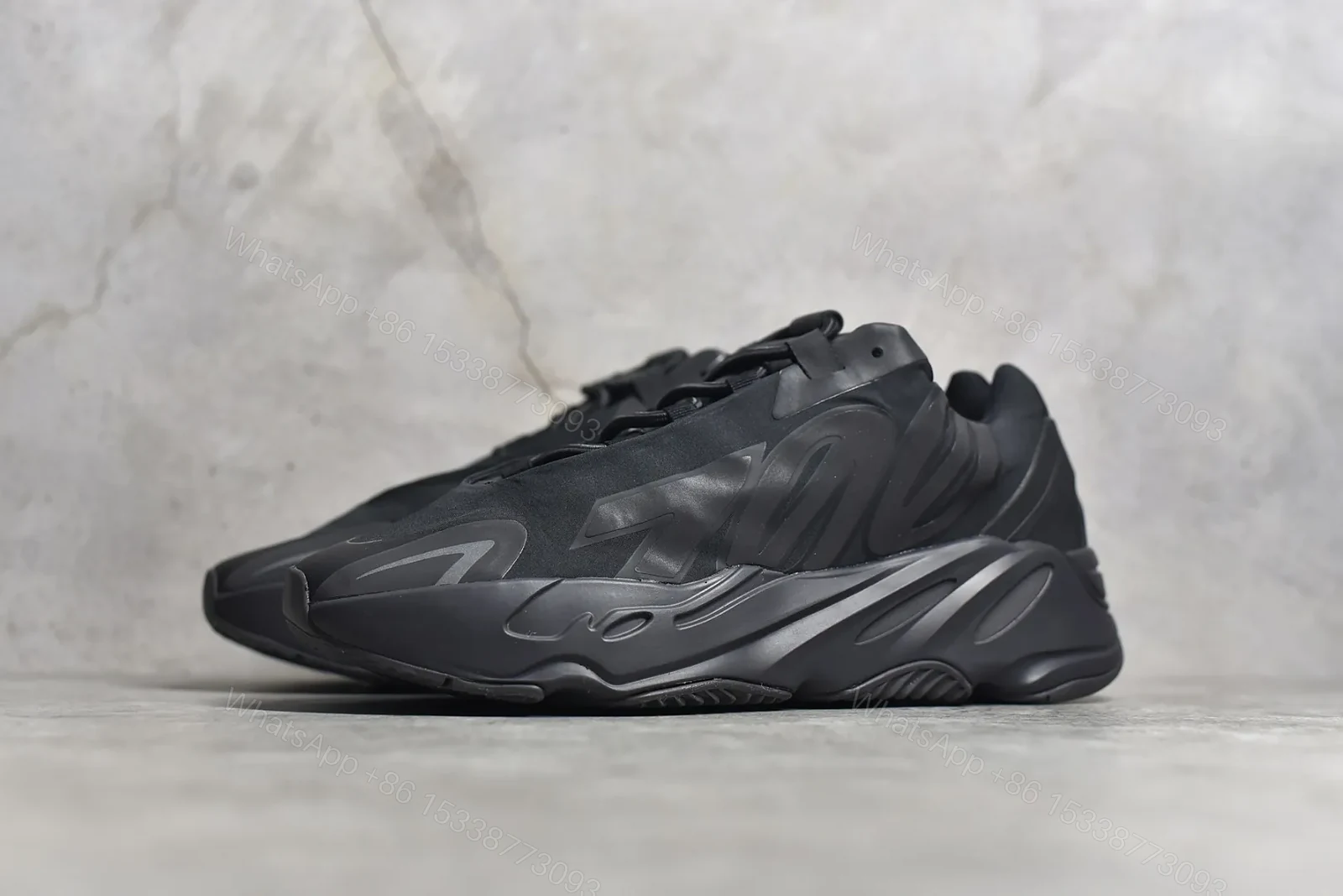 View 2 of Adidas Yeezy Boost 700 MNVN “Triple Black” Reps