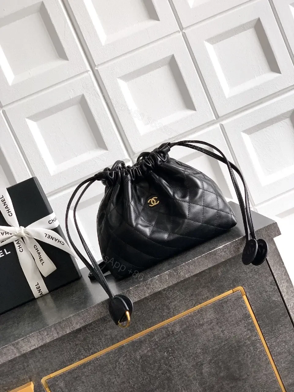 View 7 of Quilted Drawstring Bag - Black Leather-Feel, Gold Accent