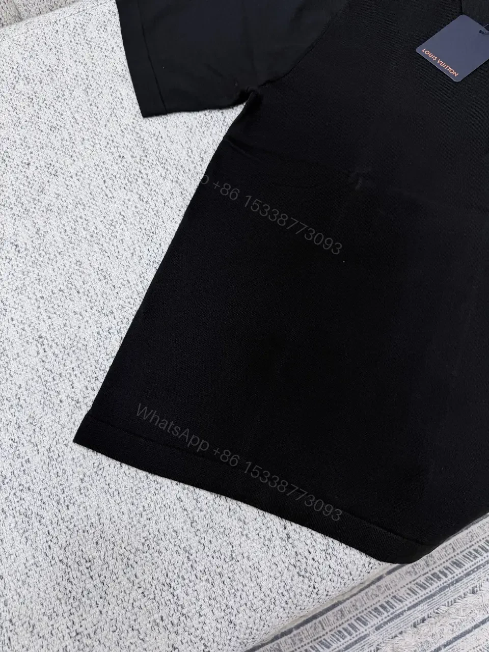 View 2 of Black Polo with Subtle Gold Logo - Refined Everyday Versatility