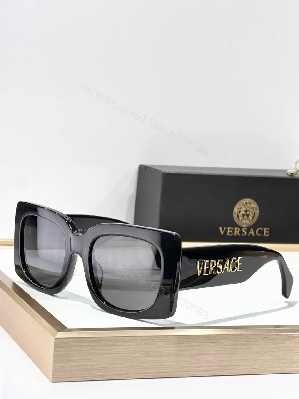 View 6 of Bold Black Statement Sunglasses with Logo-Injected Glamour