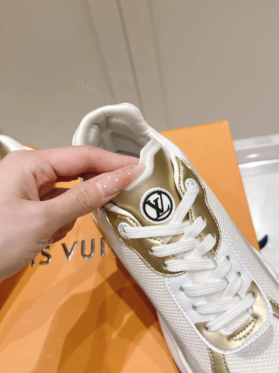 View 5 of Chunky White & Gold Luxe High-Tops: Signature LV Motif Sneakers