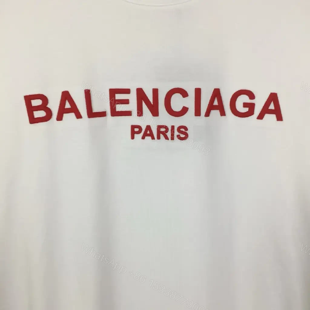 View 7 of Minimalist White Logo Tee with Bold Red Crest