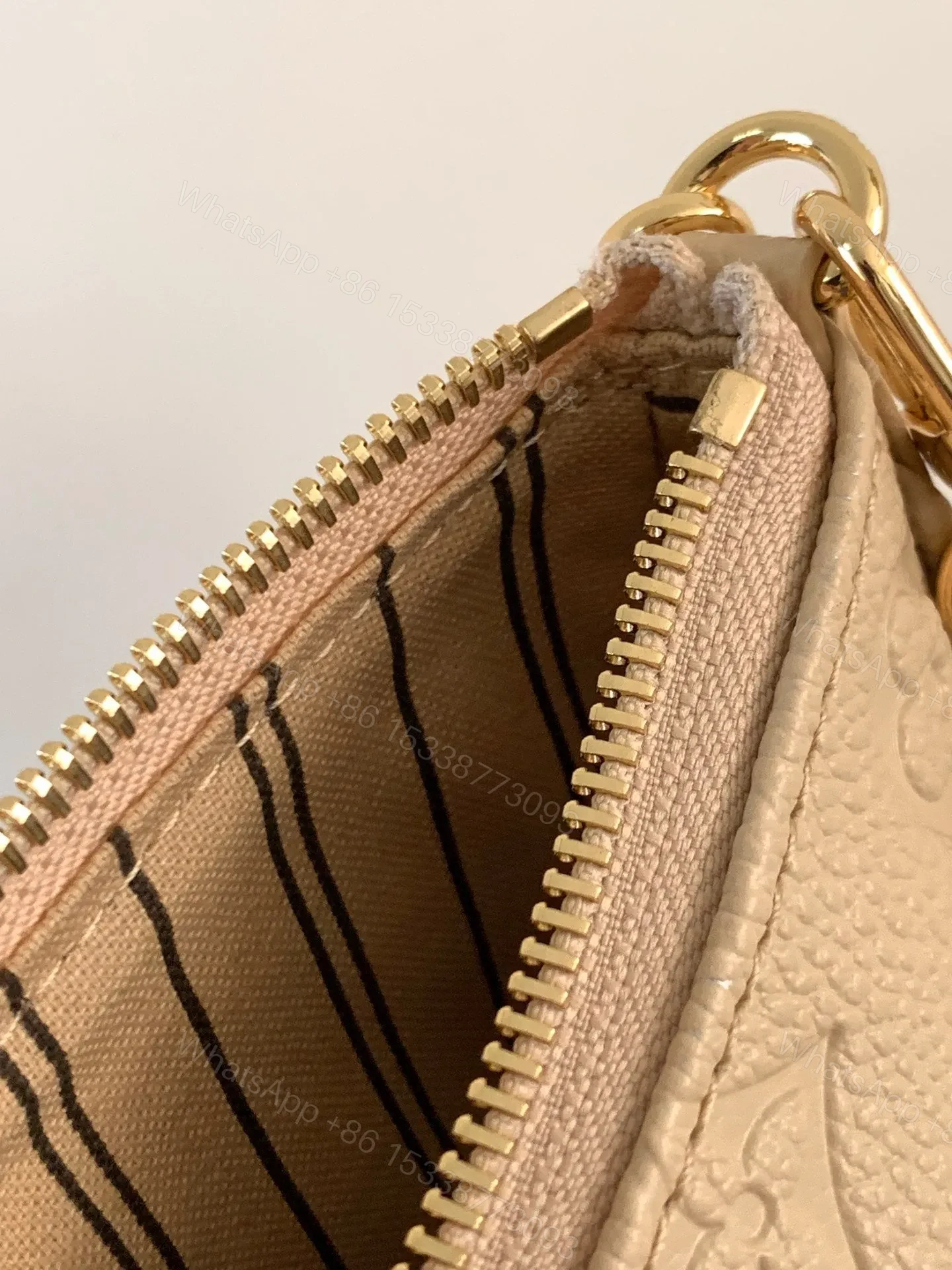 View 8 of LV EASY POUCH ON STRAP 19 IN BEIGE MONOGRAM EMPREINTE LEATHER