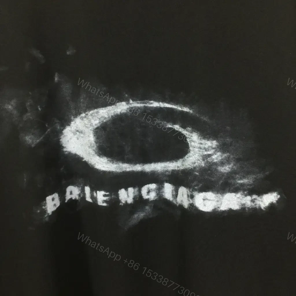 View 3 of Bold Graphic Tee with Distressed Logo: Luxe Streetwear Tee
