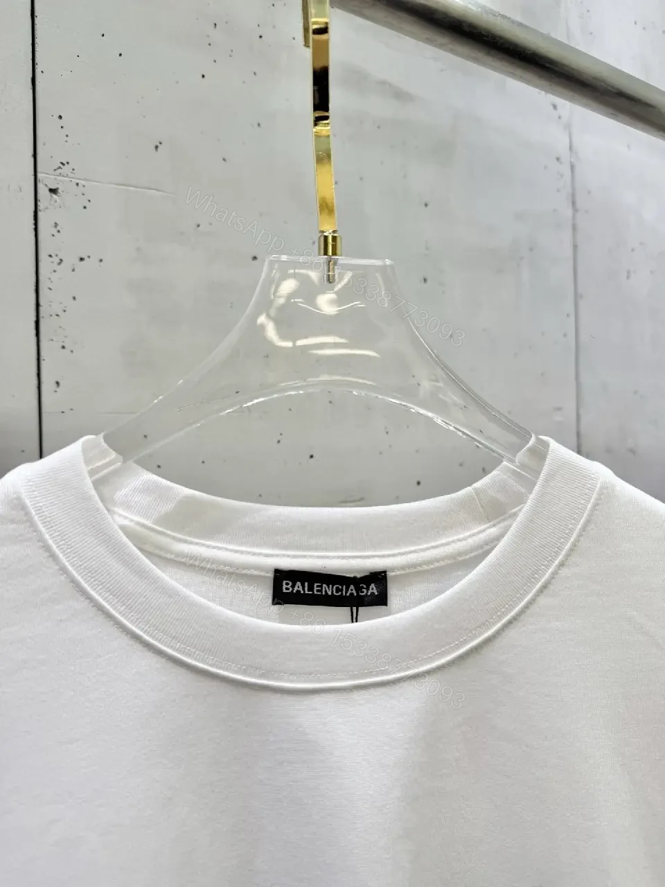 View 5 of Minimalist White Tee: Subtle Logo, Premium Cotton Short Sleeve Tee